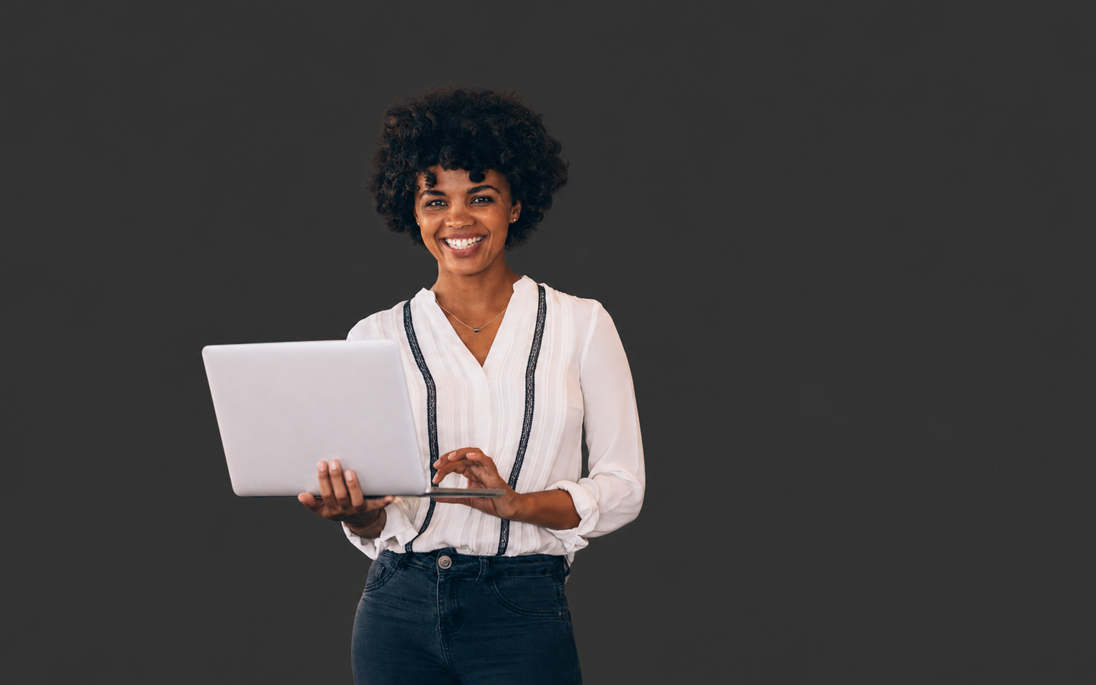 Imani persona holding a laptop for the online shopping journey project